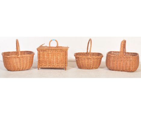 An assortment of four retro vintage 20th century wicker rattan Picnic baskets - storage baskets. three having woven handles. 