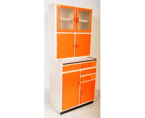 A vintage retro mid 20th century circa. 1960's painted wooden kitchen unit. The unit having gallery top with glazed twin door