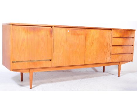 A vintage mid 20th Century teak wood side board. The sideboard having a central pair of sliding doors, bank of three drawers 