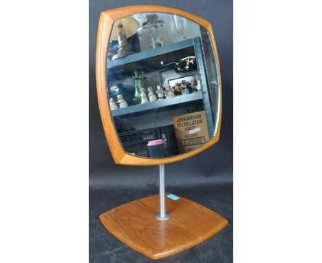 A retro vintage 20th century teak wood Danish inspired Atomic shaped table beauty mirror on stand, together with wooden lamp 