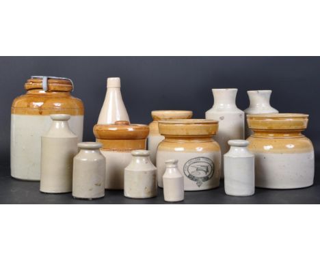 A collection of vintage 20th Century two tone stoneware lidded jars and bottles. Some white vase / bottles rounded bodies wit