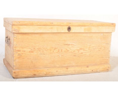 A 19th century late Victorian era pine wood blanket box having hinged lid opening to reveal candlestick holder within, brass 