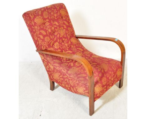 An early 20th century Art Deco circa 1930s " Banana " bentwood arm chair upholstered in floral fabric. The chair having curve