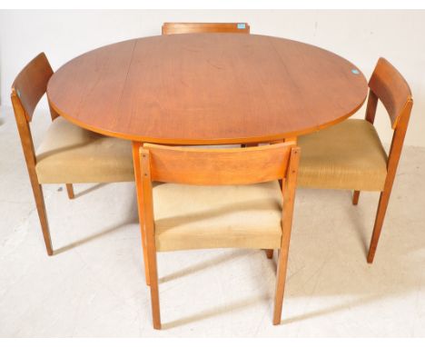 A retro vintage mid 20th Century teak drop leaf table with four chairs. The table of circular form with drop leaf top to eith