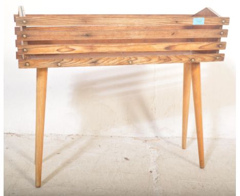 A retro vintage 20th Century teak wood plant stand / planter&nbsp;having a slatted teak wood body with chrome detyails to top