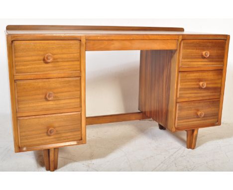 A retro vintage mid 20th century walnut office studio writing desk having a fitted gallery back on a straight top over kneeho