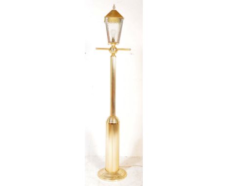A vintage 20th Century light / lamp in the form of a lamp post. The light having a glazed lantern style top raised on a a ree