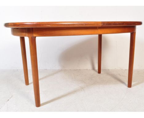 A retro vintage mid 20th century teak wood extendable dining table of oval form with flared chamfered edges over a fitted fri