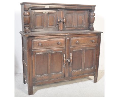 Ercol -&nbsp;A vintage retro 20th century Ercol beech and elm court cupboard sideboard having twin small cupboards to the top