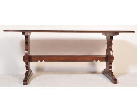 Ercol - A retro vintage 20th century beech &amp; elm&nbsp;wood refectory dining table raised on splayed leg supports united b
