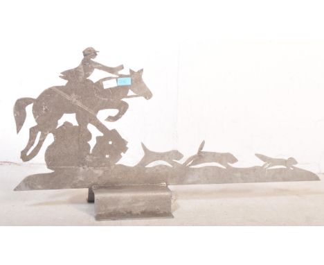 A 20th century sheet metal Art Deco style roof pediment / sign in the shape of hunting dogs &amp; rider. The piece having a s