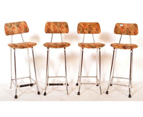 A set of four vintage retro mid 20th century circa. 1970's bar stools having back rest and seat upholstered in a floral fabri