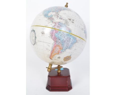 A vintage retro 20th century World Classic Series desk top globe held upon brass frame on wooden effect base. Measures 35cm t