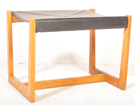 G-Plan - A retro vintage mid 20th century circa 1960s teak wood G-Plan foot resting stool having a black faux leather top wit