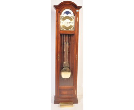 A 20th century German made reproduction grandfather - longcase clock within a mahogany veneer case with gilded face and roman