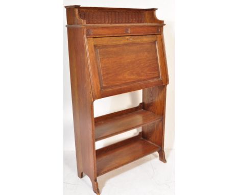 1920's oak Arts &amp; Crafts student bureau desk. The upright body with a series of shelves under fall front bureau with sect