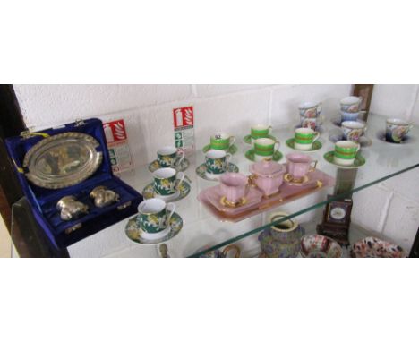Shelf of cups, saucers & silver plate