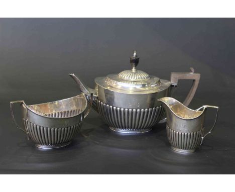 Silver partially fluted three piece tea service, 28oz gross