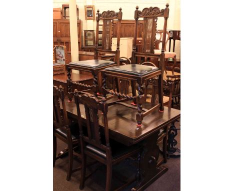 Ercol draw leaf dining table and six carved oak bergere panel back dining chairs