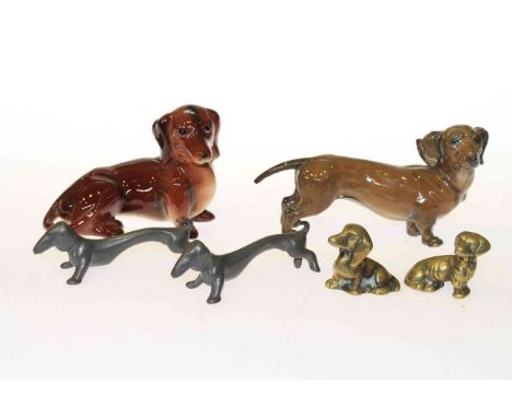 Pair of German pewter Dachshund knife rests, Rosenthal model of a Dachshund, Goebel model of a Dachshund, etc