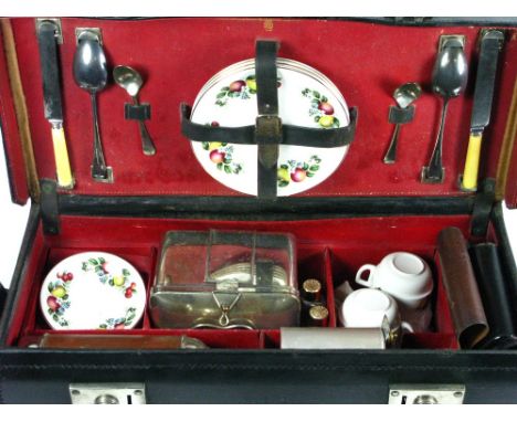*A Drew & Sons 'En Route' Picnic Set for four people,  contained in a black leather case with a red leather lining, while inc