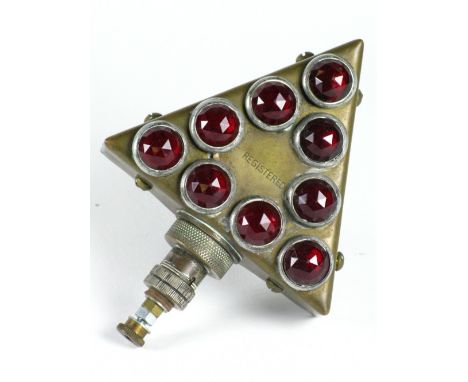 *Electric Rear Lamp in the shape of a triangle with nine multi-faceted red glasses, bayonet electrical fittings below and a r