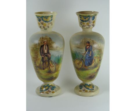 *A Pair of Cream Glass Vases with tulip rims and button feet,  the bodies with over glaze hand-painted depictions of a lady a