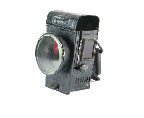 *'The Empress'. An oil-powered safety bicycle lamp by Powell and Hanmer,  with red side glasses and a bevelled edge front gla