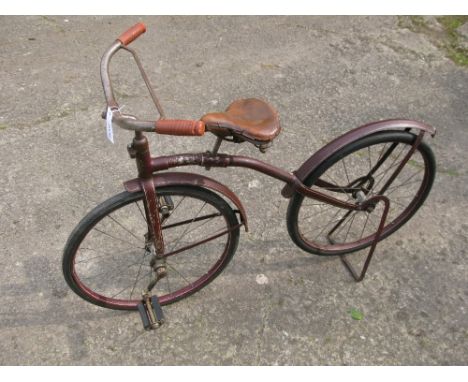 *A circa 1920 'Eagle' child's front-drive bicycle, of American manufacture,  it possesses 20-inch crescent rims with solid ru
