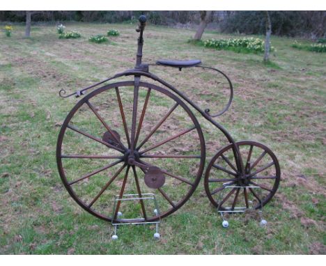 *A Transitional VelocipŠde. Possessing a 38-inch iron tyred driving wheel,  and a 22-inch rear wheel, the unusual duplex back
