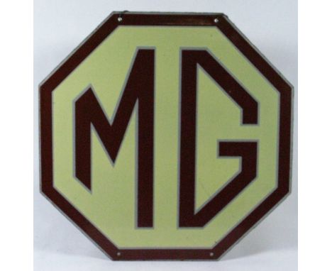 *M.G. An octagonal hanging showroom enamel sign,  with hanging holes' top and bottom and original hanging chains, in sound co