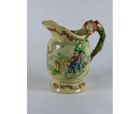 *Daisy Bell. A pitcher by Crown Devon (Shorter & Son),  having a moulded depiction of a tandem and riders, hand-finished in b