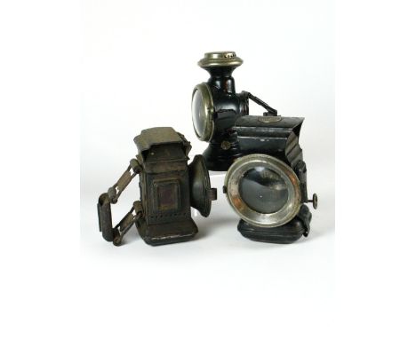 *Three Oil Lamps. A small French example with nickel-plated parts and black enamel finish,  and two others  (3)