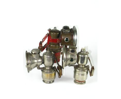 *Three acetylene gas lamps, one each by Powell and Hanmer and Lucas,  together with a 1930s GPO red-enamelled lamp by Miller,