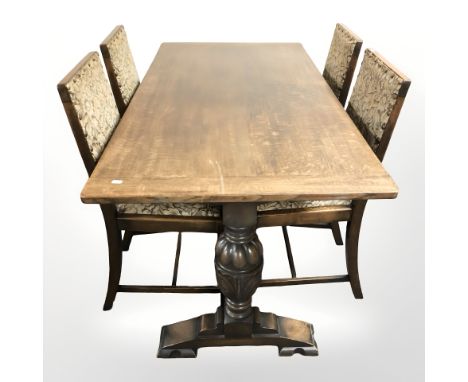 A reproduction oak 5' refectory dining table and four chairs in brass studded tapestry fabric 