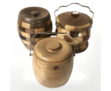 Three wooden biscuit barrels, two with ceramic liners.
