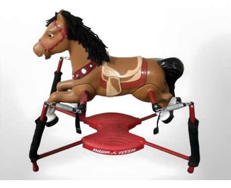 A modern childs ride-on rocking horse.