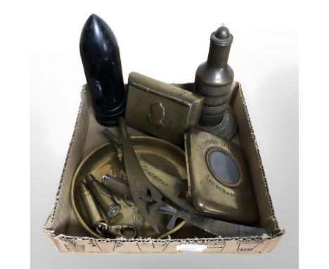 A group of trench art items including a trinket box, letter knives, cigarette case, paperweight, inert ammunition shell, etc.