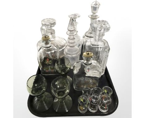 A group of crystal and pressed glass decanters, Holmegaard decanter with stopper, miniature drinking glasses, etc.