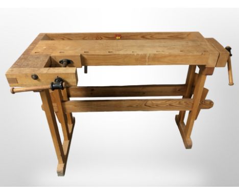 A 20th century pine work bench fitted with a vice, 115 cm x 60 cm x 81 cm 