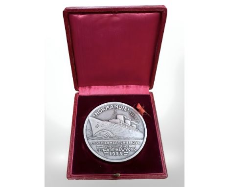 An extremely rare and fine Art Deco silver medal by Jean Vernon (French, 1897 - 1975) commemorating the launch and maiden voy
