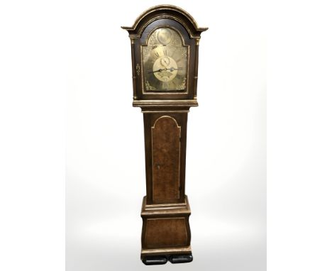 A 20th century continental oak longcase clock with gilded decoration, with pendulum and weights, height 210 cm 
