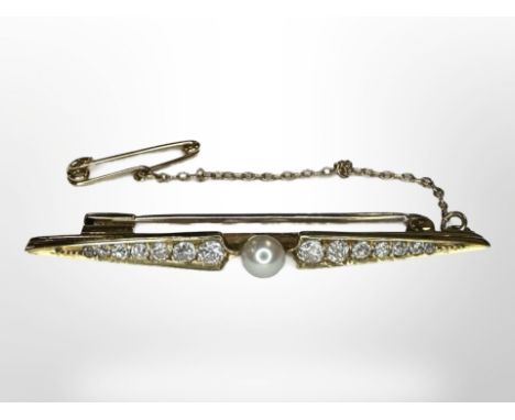 A yellow gold graduated diamond bar brooch, set with a seed pearl, 4g, length 50mm, with safety chain. 