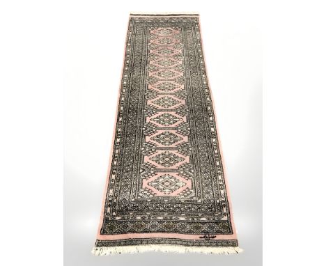 A Lahore Bokhara runner, Pakistan, signed to one end, 245 cm x 82 cm 