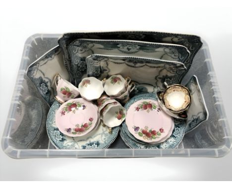 A group of Queen Anne fine bone china tea cups and saucers, decorated with strawberries, a Royal Albert heirloom cup and sauc