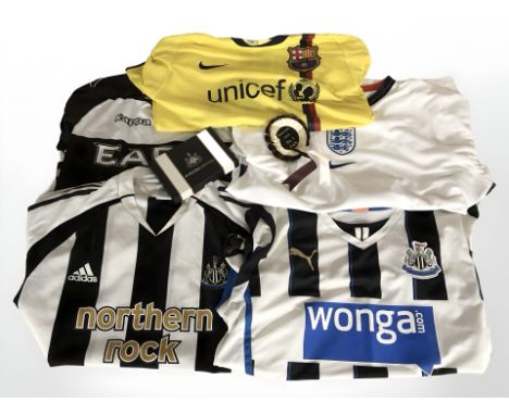 A Barcelona Lionel Messi football shirt, size XL, Newcastle United shirt, size L, another size M, two other shirts, Newcastle