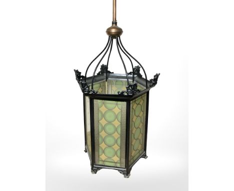 A 20th century painted metal hexagonal hall lantern, with two-tone glass panels, height 96 cm, including fitting. CONDITION R