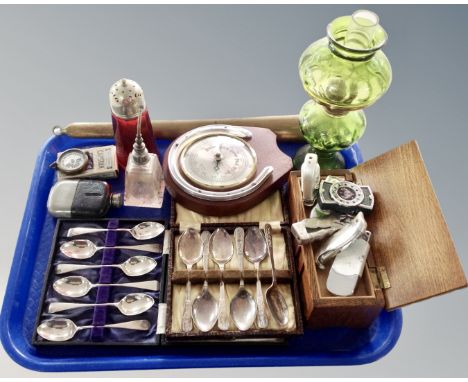 A tray containing a barometer, a glass miniature oil lamp, silver plated cutlery, miniature hip flask, table lighters.