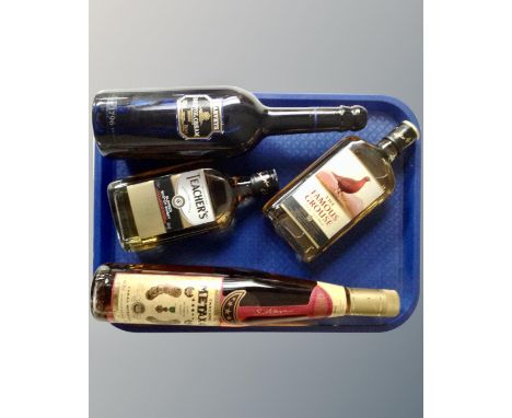 Four bottles of alcohol including Harvey's Bristol Cream, Teacher's Scotch, The Famous Grouse Scotch etc.