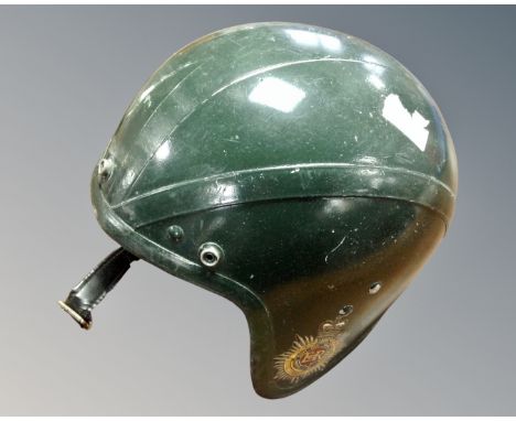 An early 20th century Royal Corps of Transport cycle helmet.